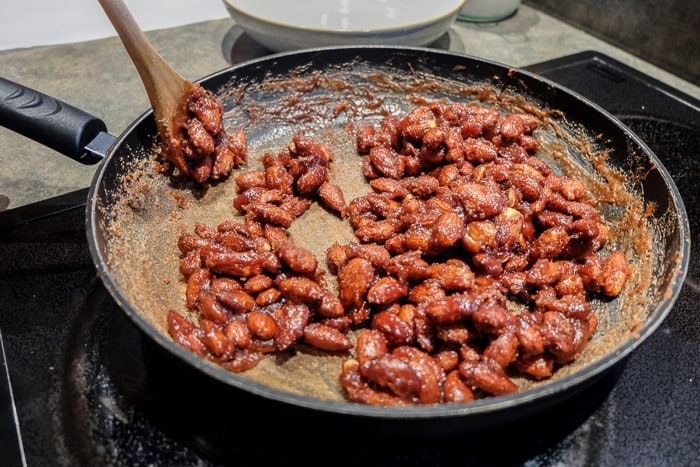 candied almonds sticky in a pan on stovetop
