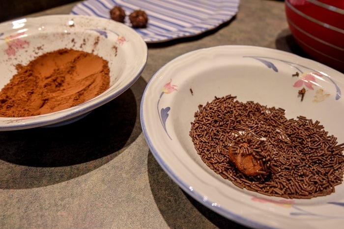 bowl of sprinkles and bowl of cocoa powder on kitchen counter