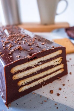 chocolate cake with cookie layers on blue and white plate