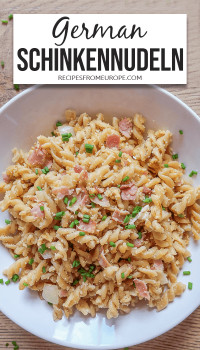 Photo of pasta with ham in white bowl with text overlay for Pinterest