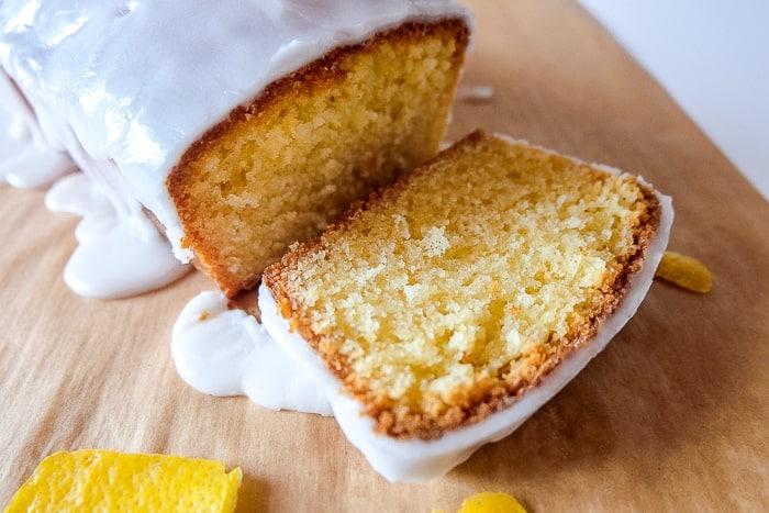 one slice of yellow lemon cake coated in white icing