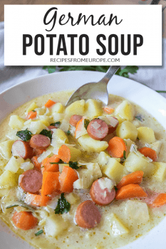 Photo of potato soup with cut up carrots and sausages in white bowl with spoon and text overlay saying German potato soup