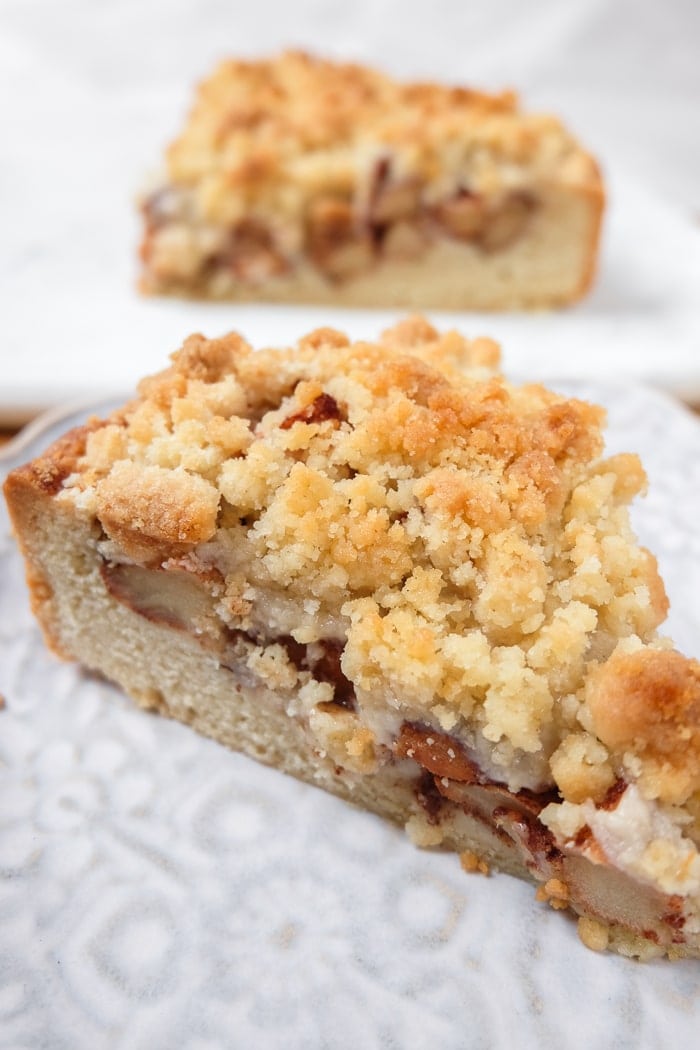 slices of german apple cake with crumbles on plate