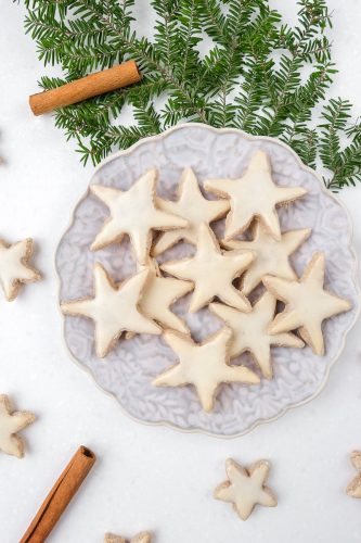 german cinnamon stars on a plate on white counter