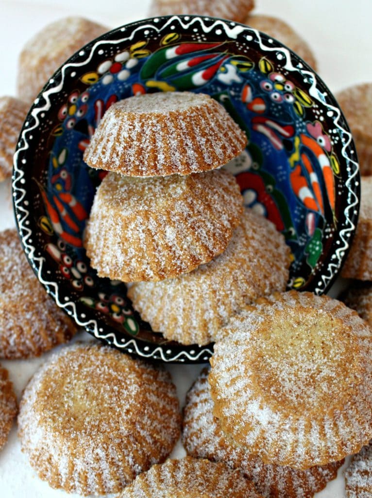 small cookies with granulated sugar sprinkled on top in colorful bowl. 