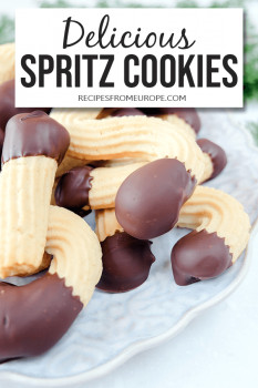 Photo of cookies with chocolate coating on plate with text overlay saying delicious spritz cookies