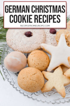 Photo of different cookies on clear plate with text overlay saying German Christmas cookie recipes