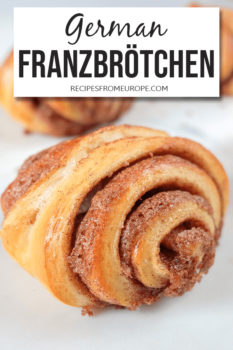 Franzbrötchen similar to cinnamon rolls on light surface with text overlay saying German Franzbrötchen
