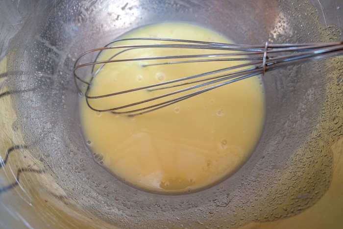 yeast whisked into baking bowl with metal whisk