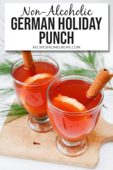 Photo of red drink in clear glasses with cinnamon sticks and text overlay saying non-alcoholic German holiday punch