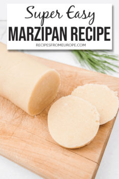 Photo of roll of marzipan on wooden cutting board with text overlay saying super easy marzipan recipe
