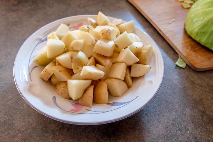 cubed pieces of potatoes in bowl on counter