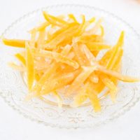 plate of candied lemon peels on white counter