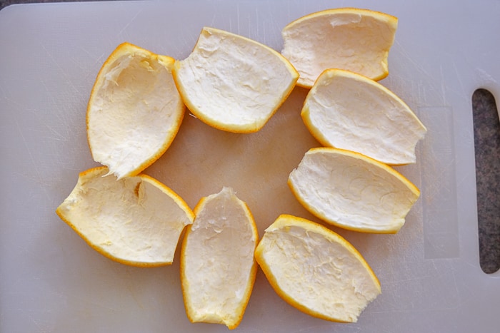 orange peels cut on cutting board