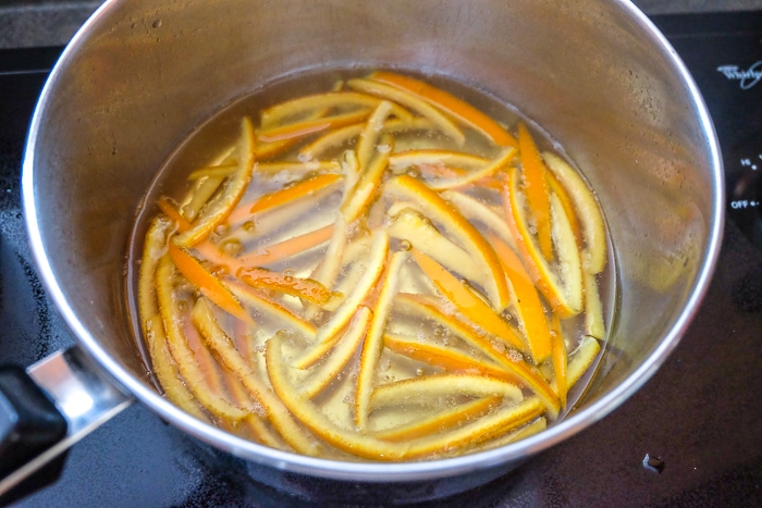 boiling orange peels in pot on stove