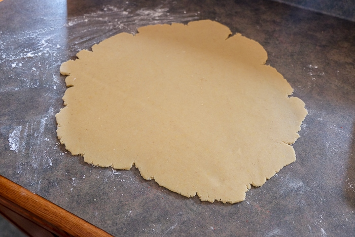 flattened cookie dough on kitchen counter