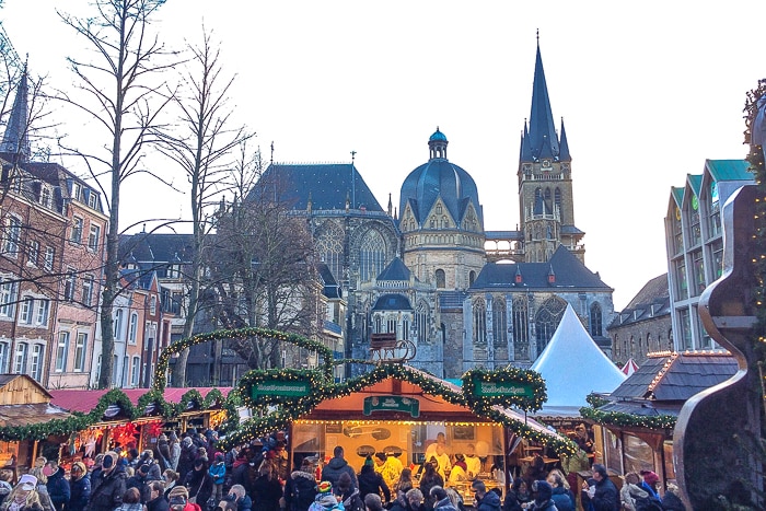 german chrtistmas market in aachen with cathedral in background