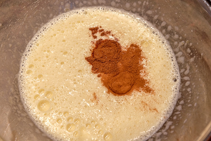 gingerbread cookie batter in mixing bowl with gingerbread spice