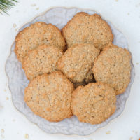 german oatmeal cookies on festive plate with oats around