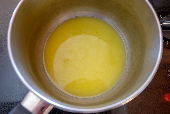 melted butter in silver pot on stove