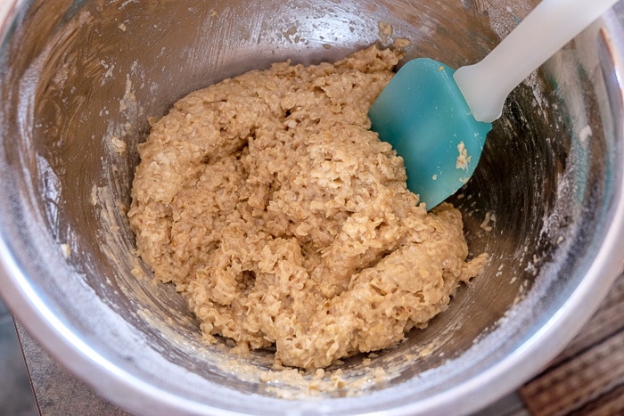 oatmeal cookie batter with spatula in mixing bowl