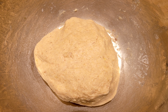ball of dough in metallic mixing bowl