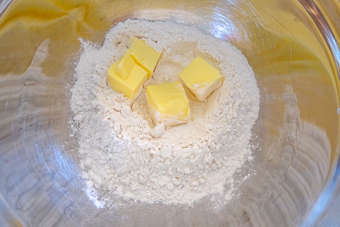 butter in flour in mixing bowl