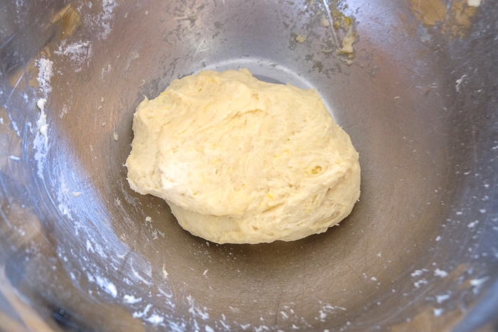 ball of hungarian apple pie dough in silver mixing bowl