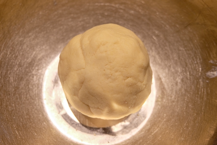 ball of marzipan in metal mixing bowl