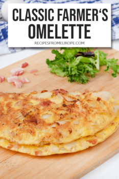 Photo of omelette on wooden platter with lettuce in background and text overlay saying classic farmer's omelette