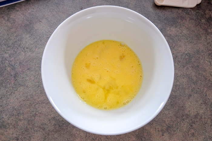 eggs scrambled in white bowl on counter