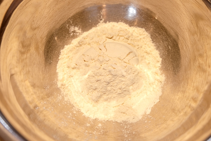 metallic mixing bowl of flour