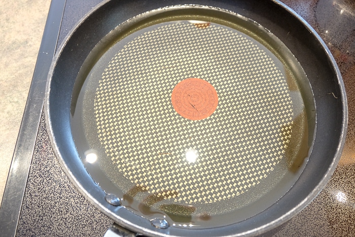 frying pan full of oil on stovetop