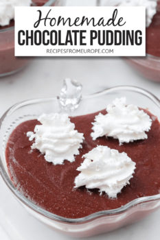 Chocolate pudding in clear bowl with whipping cream on top and text overlay saying homemade chocolate pudding