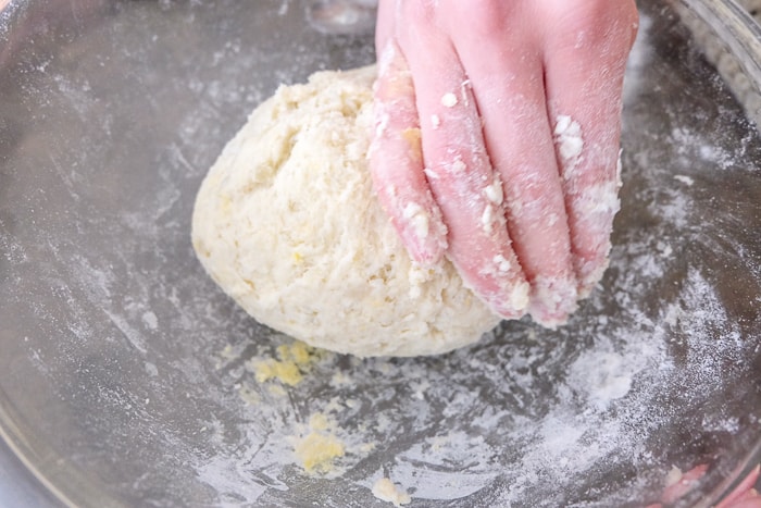 ball of mohnnudeln dough rolled on counter in flour