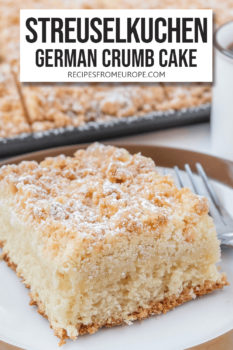 Slice of streusel cake on white plate with brown rim and fork next to it with text overlay saying "Streuselkuchen German crumb cake"