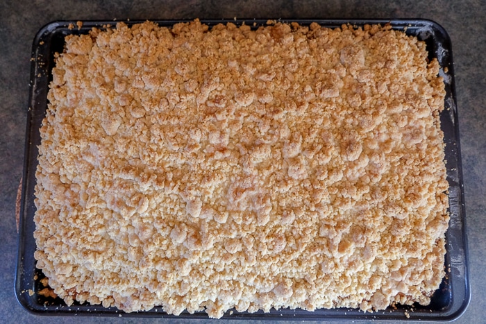 cooked german crumb cake in pan on counter top