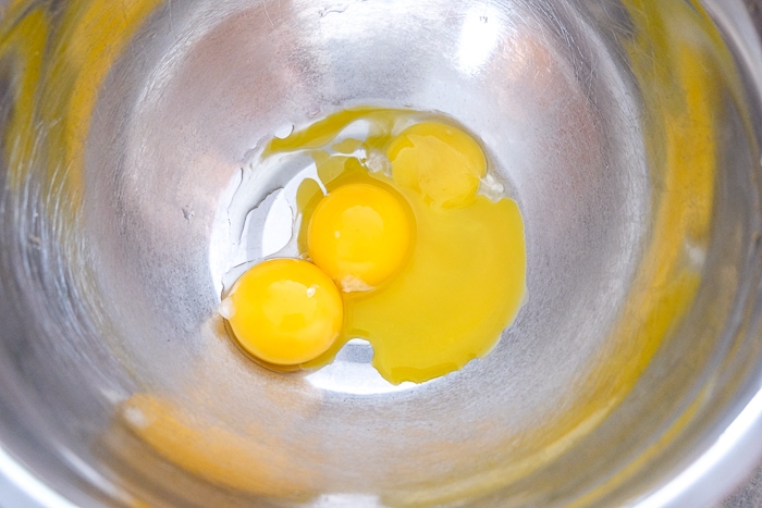 egg yolks in silver bottom mixing bowl