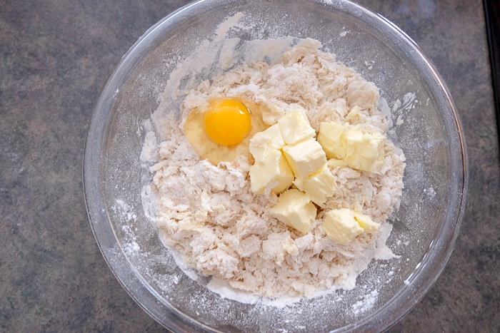 eggs and butter in mixing bowl for butter cake ingredients
