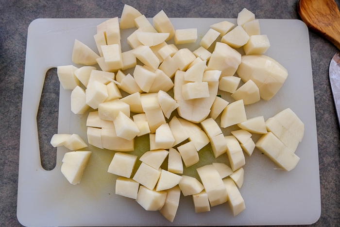 chopped potatoes on white cutting board