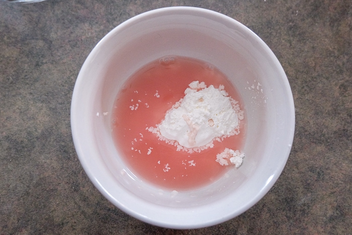 bowl of red juice and corn starch on counter