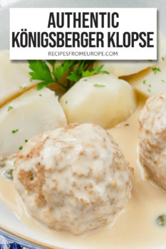 Boiled meatballs with creamy sauce on top and boiled potatoes in bowl plus text overlay saying "authentic Königsberger Klopse"