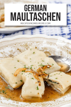 Three stuffed pasta in bowl with beef broth and spoon plus text overlay saying "German Maultaschen"