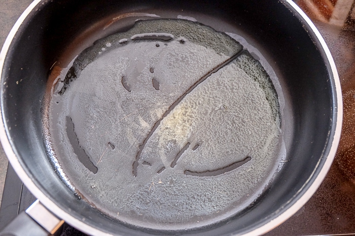 melted butter in large sauce pan on stove top