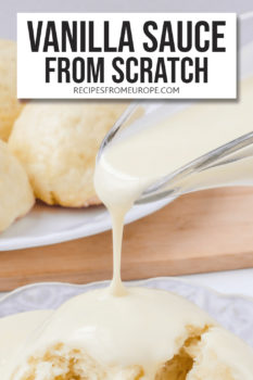 vanilla sauce being poured out of glass serving boat onto plate with yeast dumpling plus text overlay saying "vanilla sauce from scratch"