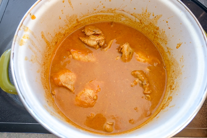 chicken thighs in chicken paprikash pot on stove top
