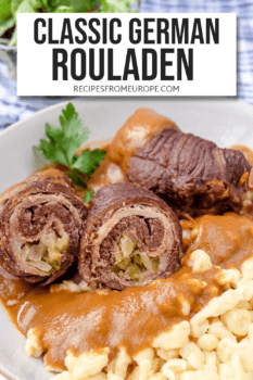 rolled beef filled with bacon, pickles and onions in bowl with egg noodles and gravy plus text overlay saying "classic German rouladen"