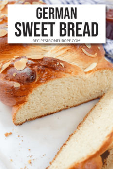 braided bread with sliced almonds on top and end cut off and slices in the front plus text overlay saying "German sweet bread"