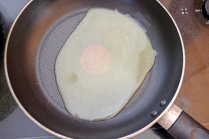 oil in frying pan on stove top