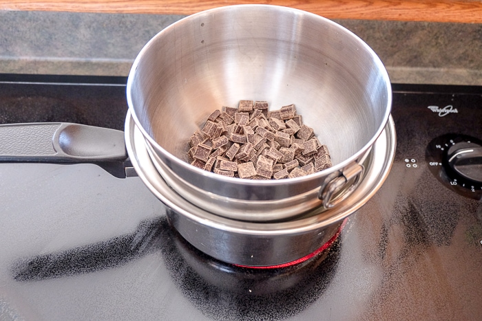 melting chocolate in a bowl in pot on stove top